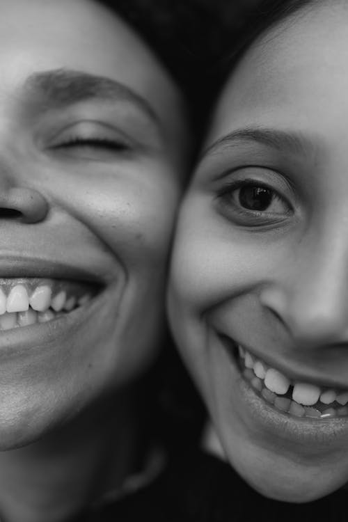 Grayscale Photo of a Woman and a Woman