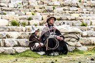 A Grandfather with Her Granddaughter in Their Traditional Wear
