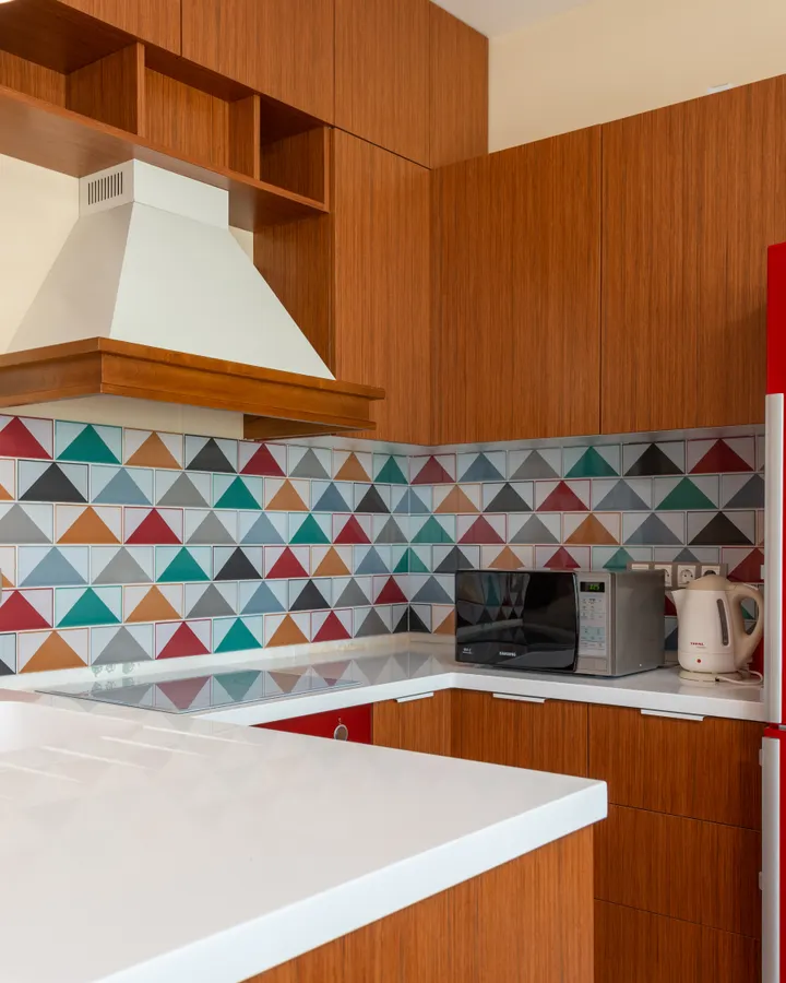 Miele refrigerator repair in La Mesa, CA Contemporary kitchen with colorful geometric tiles and red appliances, Miele refrigerator repair in La Mesa