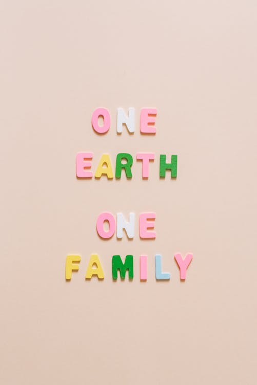 One Earth One Family Lettering on a White Surface