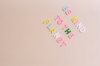 Colorful Letter Tiles on a Beige Background