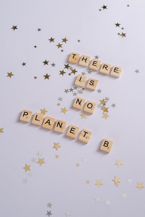 Scrabble Tiles on a White Surface with Stars