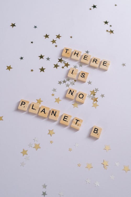 Scrabble Tiles on a White Surface with Stars