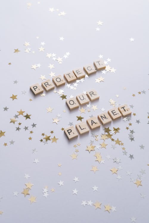 Protect Our Planet Text on a White Surface with Stars