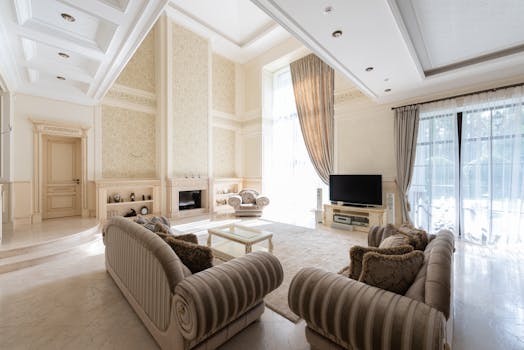 Luxurious and spacious living room with elegant decor, rich textures, and large windows.