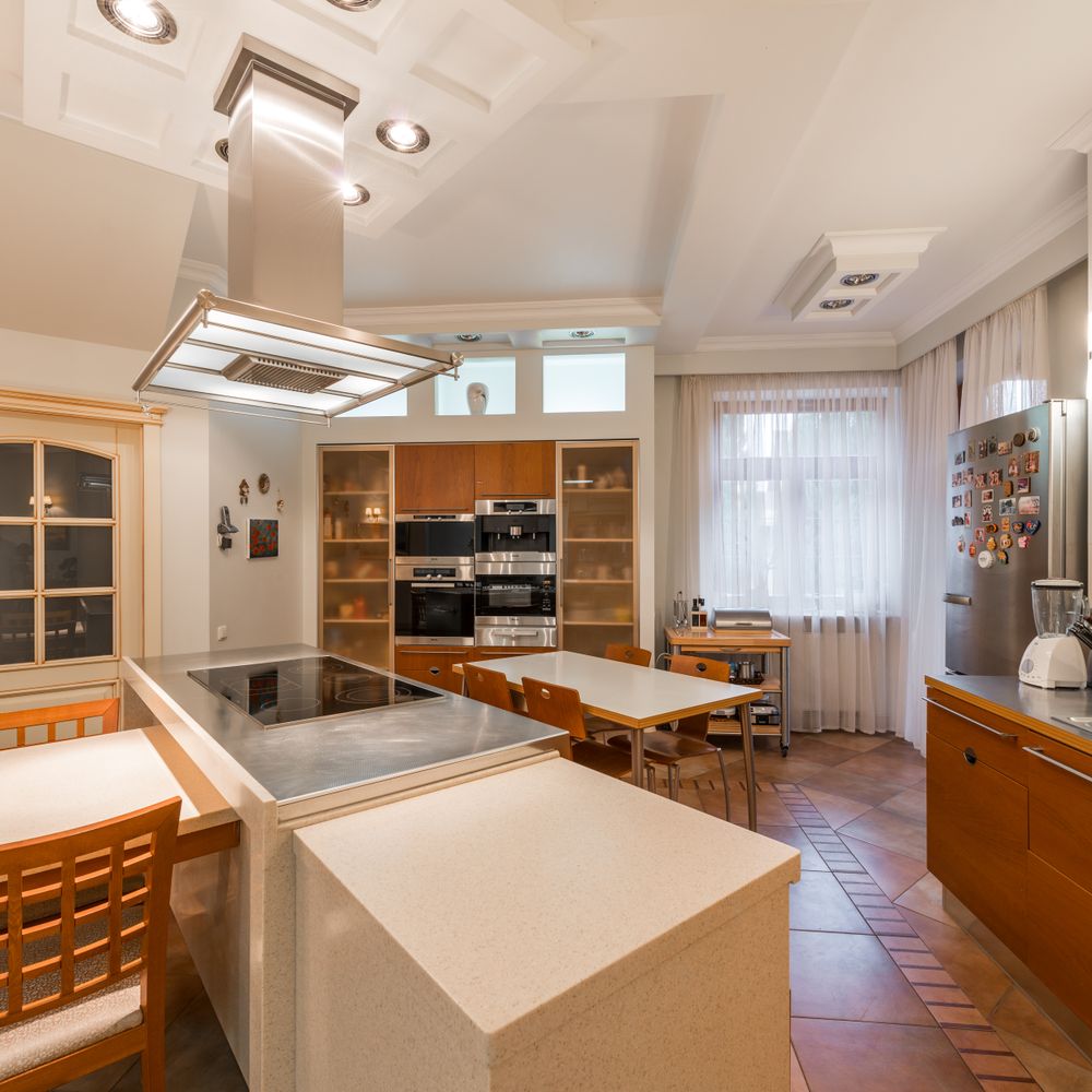 Kitchen Spraying in North Kensington — clean edges cut in around trim and sockets