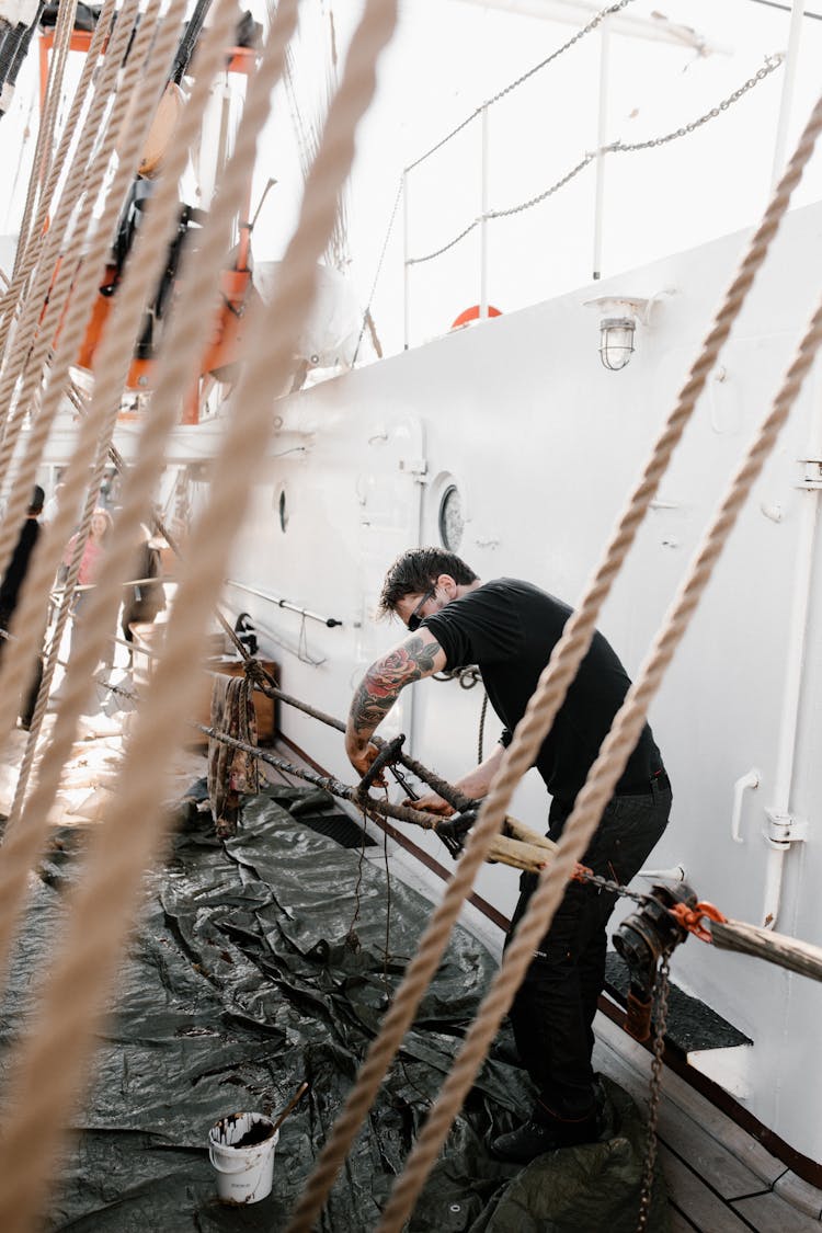 A Man Working On The Rigging