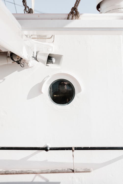 Window on White Wall of Vessel