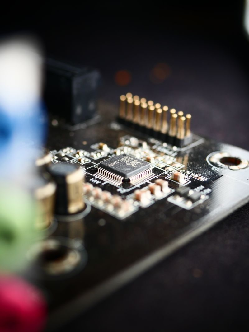Macro close-up of a microchip and components on a circuit board