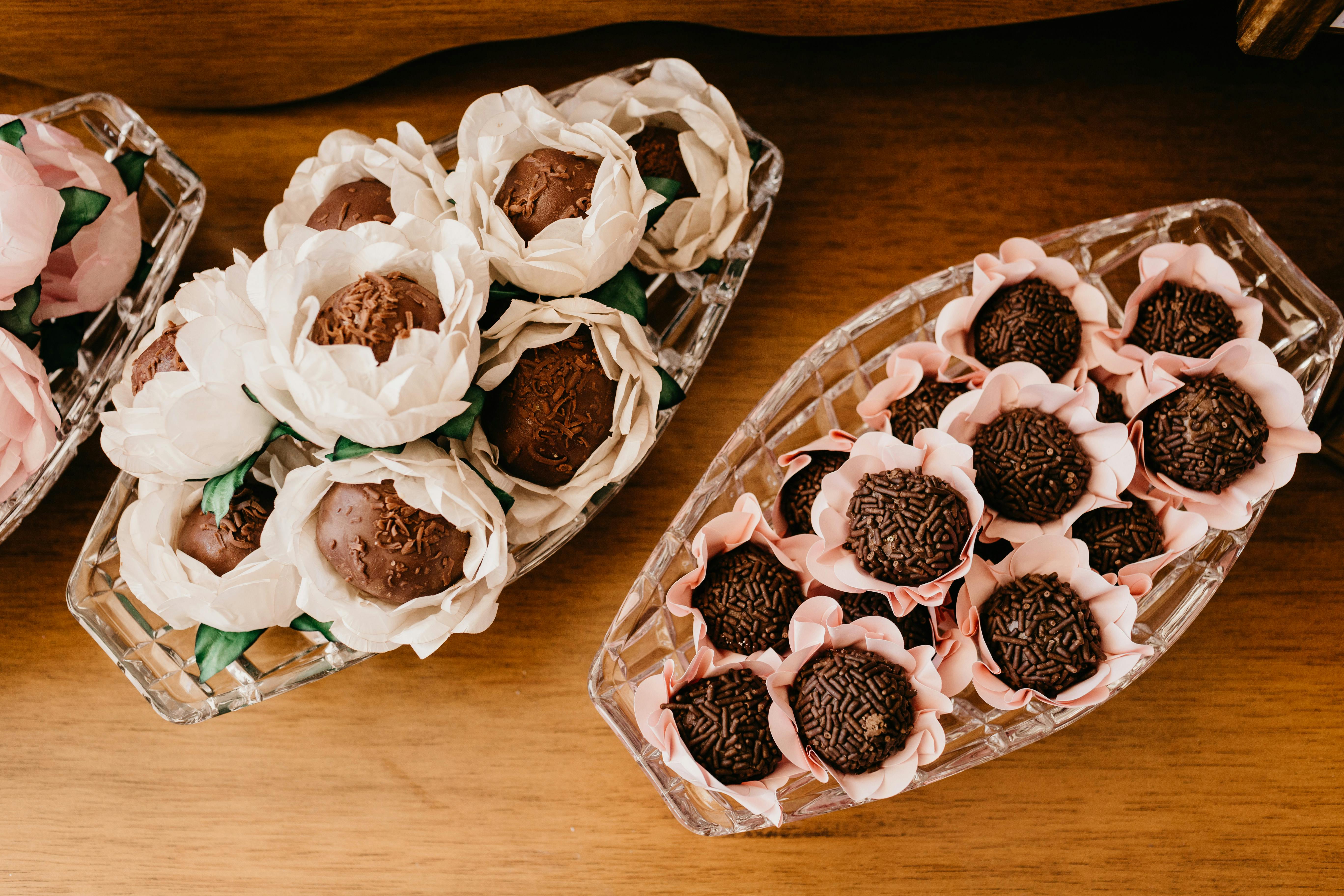 assorted delicious chocolate truffles in decorative flowers