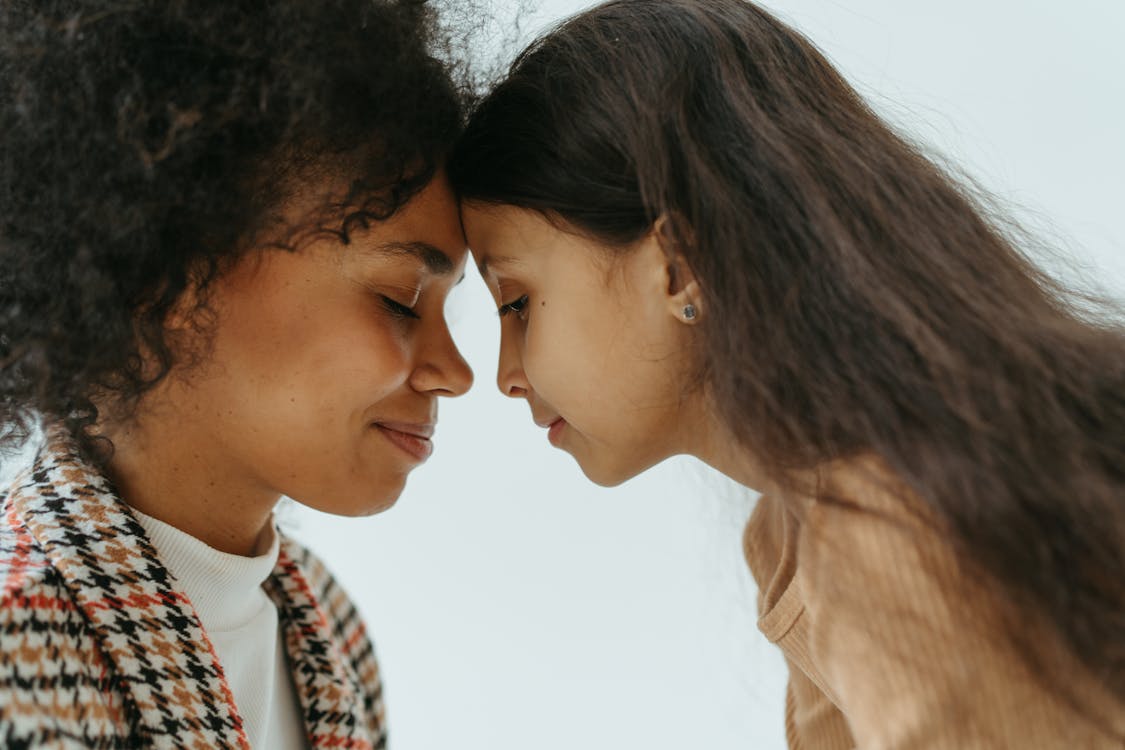 Free A Woman and a Young Looking at each other Stock Photo