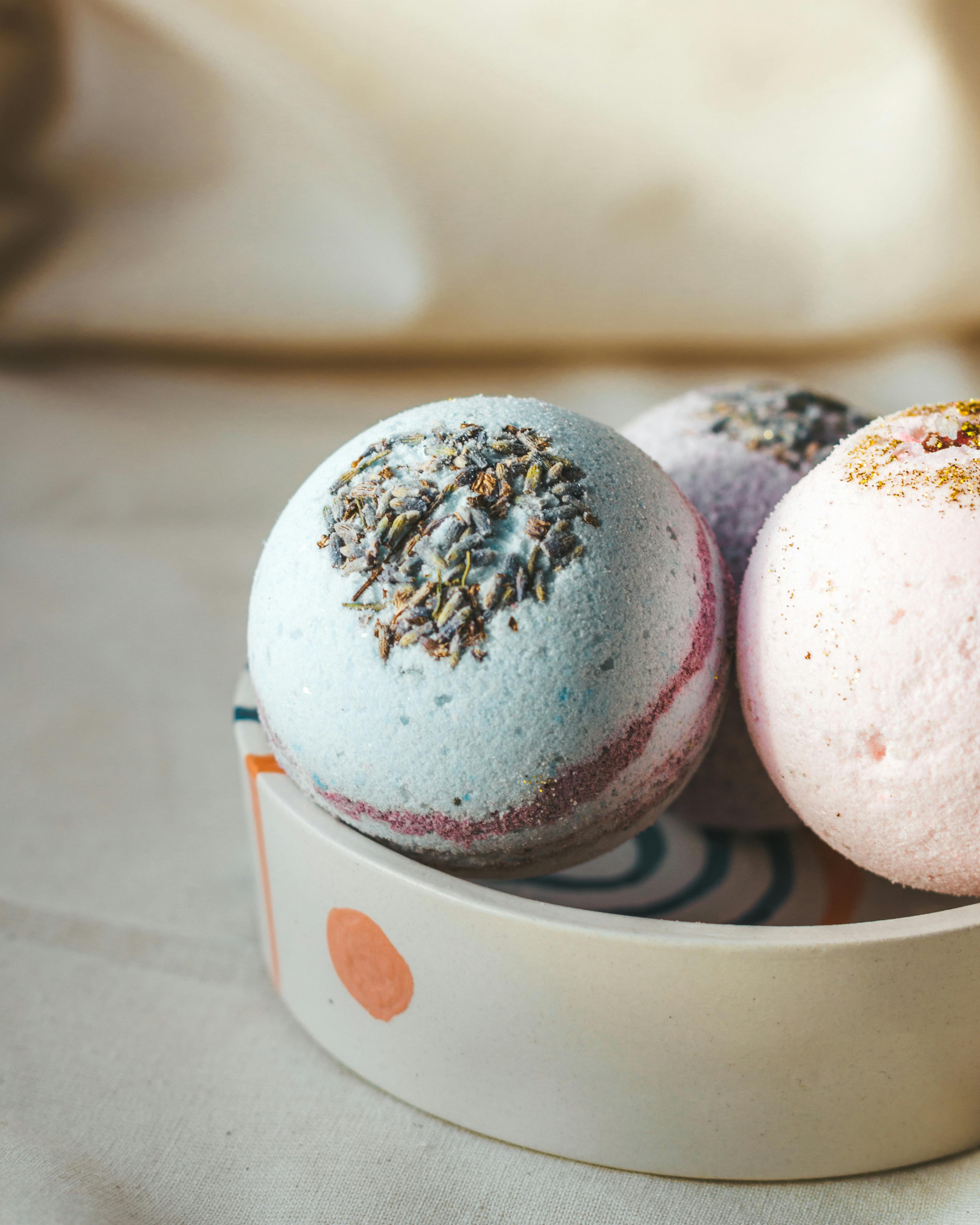 multicolored aromatic bath bombs in bowl