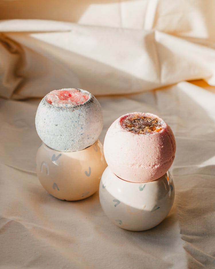 Fragrant Bath Bombs Arranged On Light Fabric