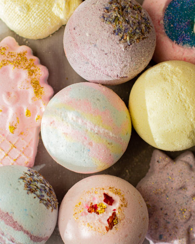 Fragrant Multicolored Bath Bombs Arranged On Table