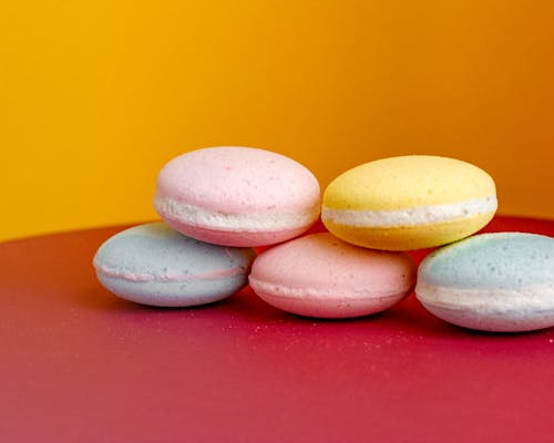 Free Bath bombs in shape of macaroons arranged on table Stock Photo