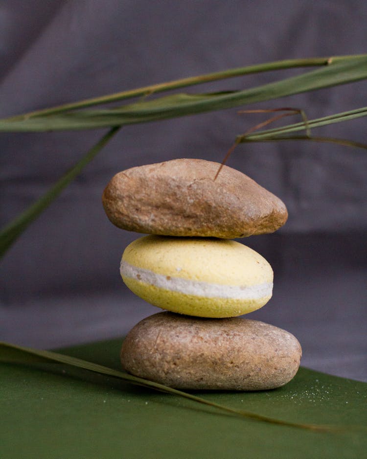 Arrangement Of Bath Bomb And Stones Placed On Table