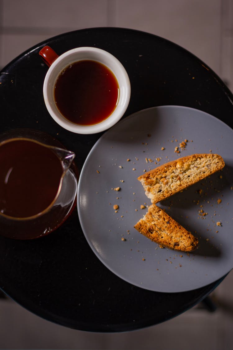 Cup Of Tea Placed Near Plate With Cake