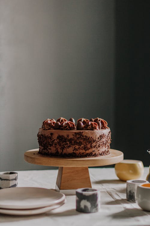 Yummy chocolate cake on wooden stand