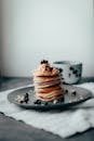 Sweet pancakes with berries and almond crumb