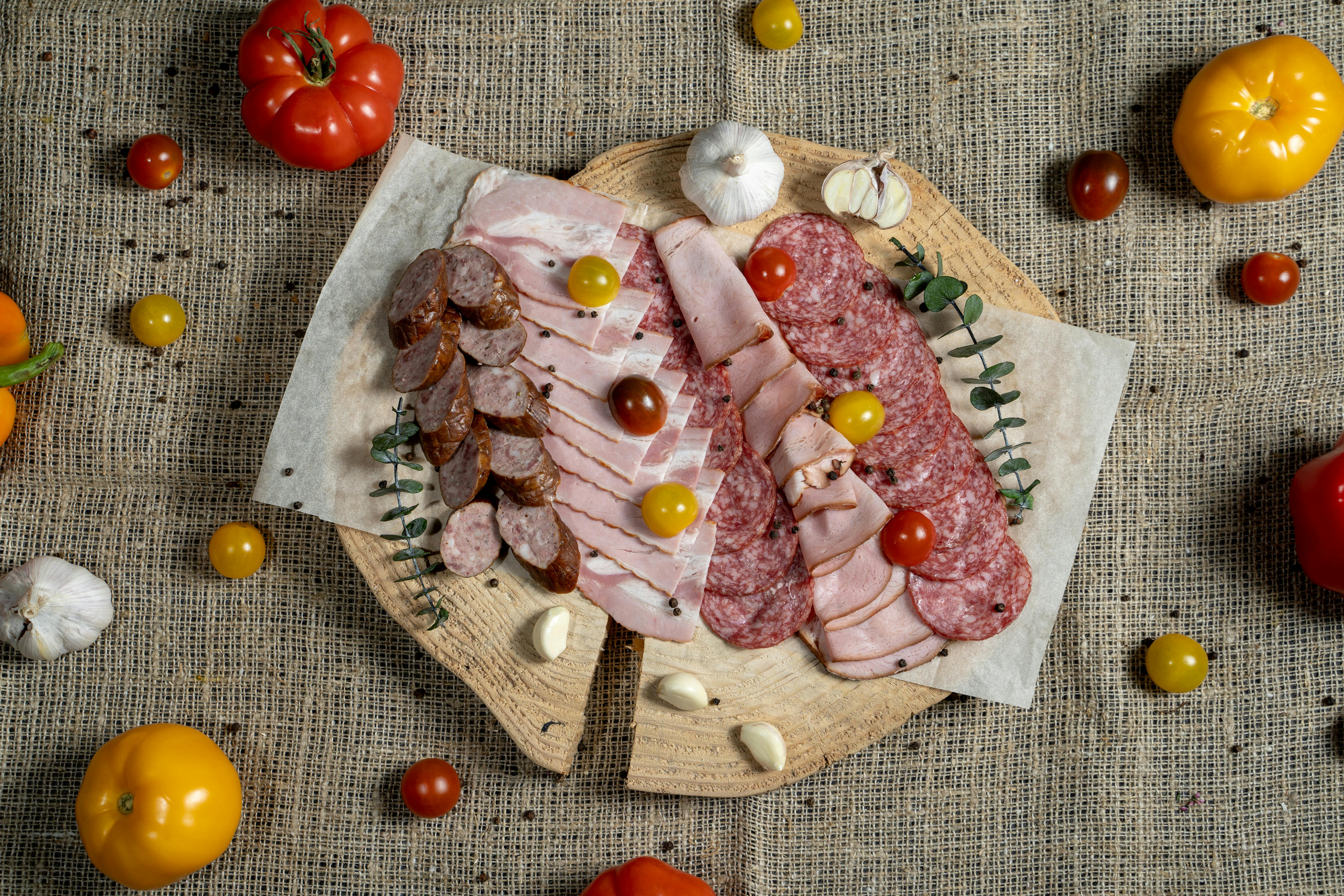 Sausage Salami Ham on Round Wood Plate