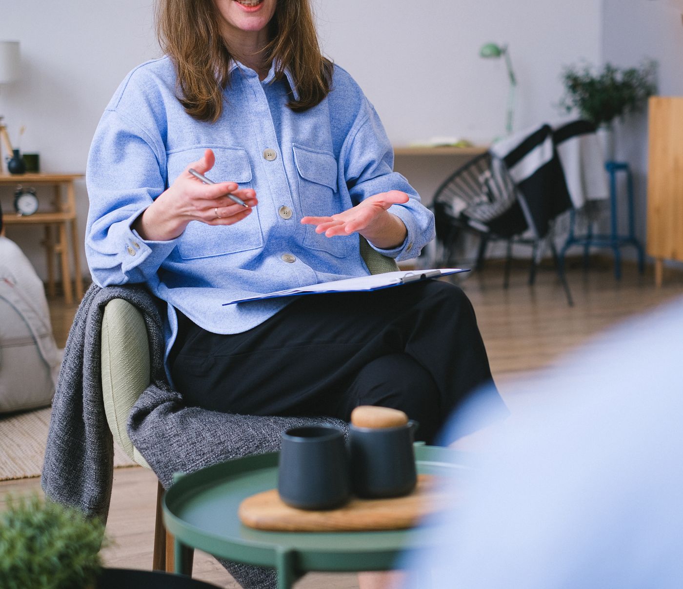 Mental health professional speaking with a patient during a first psychiatry consultation