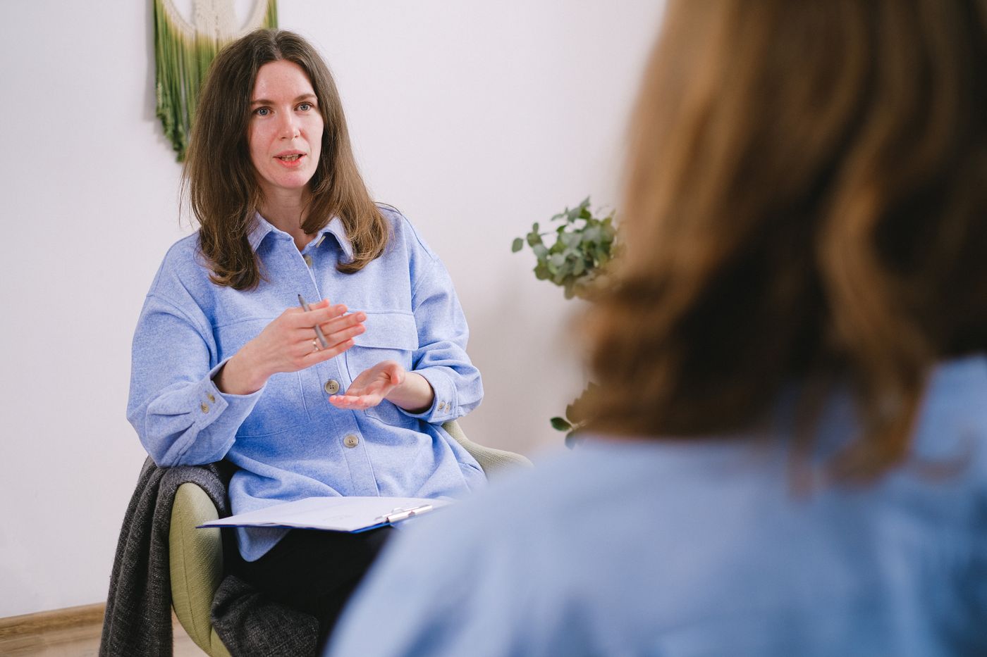 Mental health professional discussing medication options and ongoing monitoring with a patient