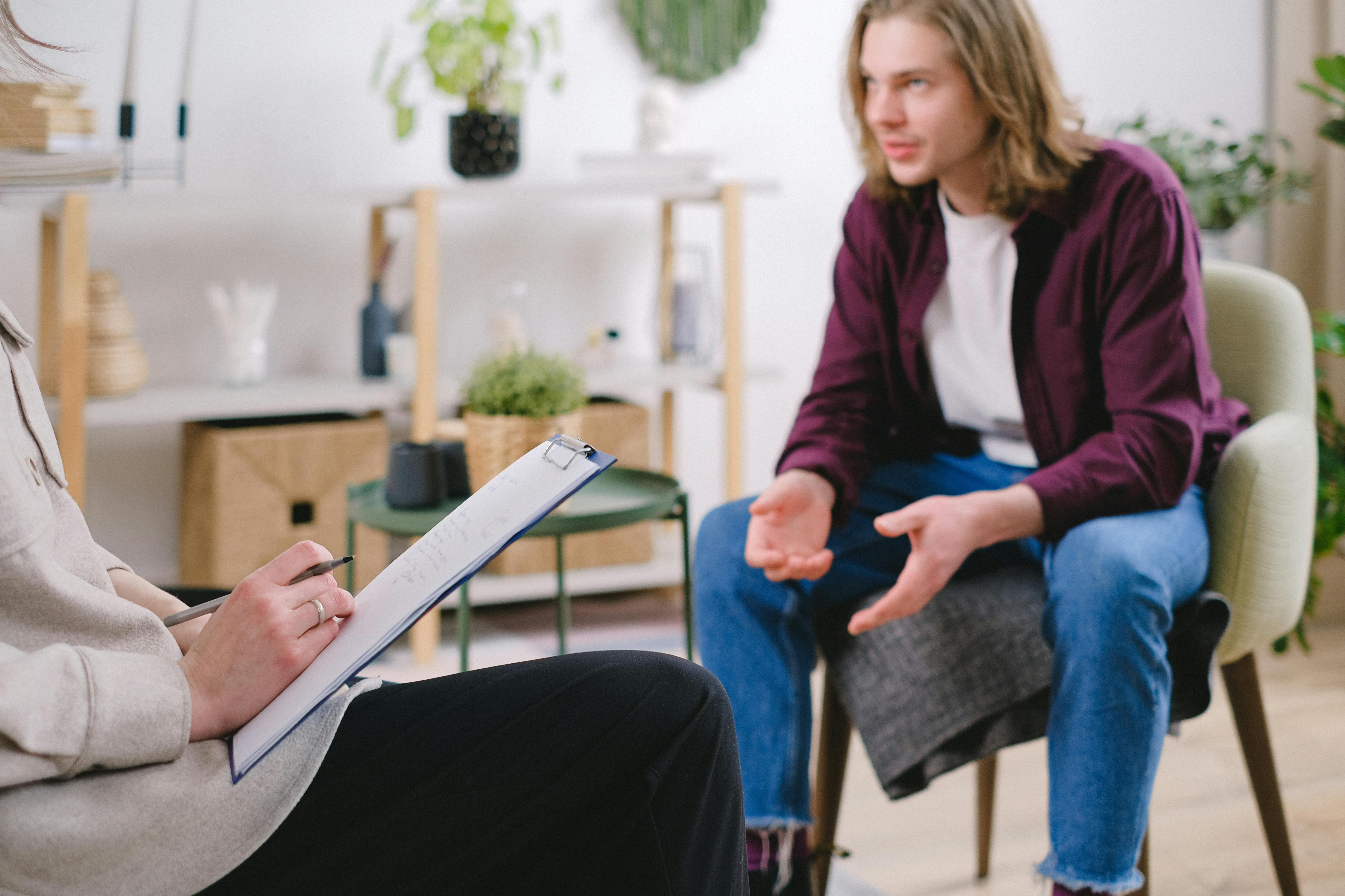 close up shot of a person interviewing a man