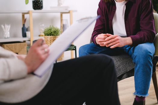Therapist and client discussing issues in a psychotherapy session, highlighting mental health support.