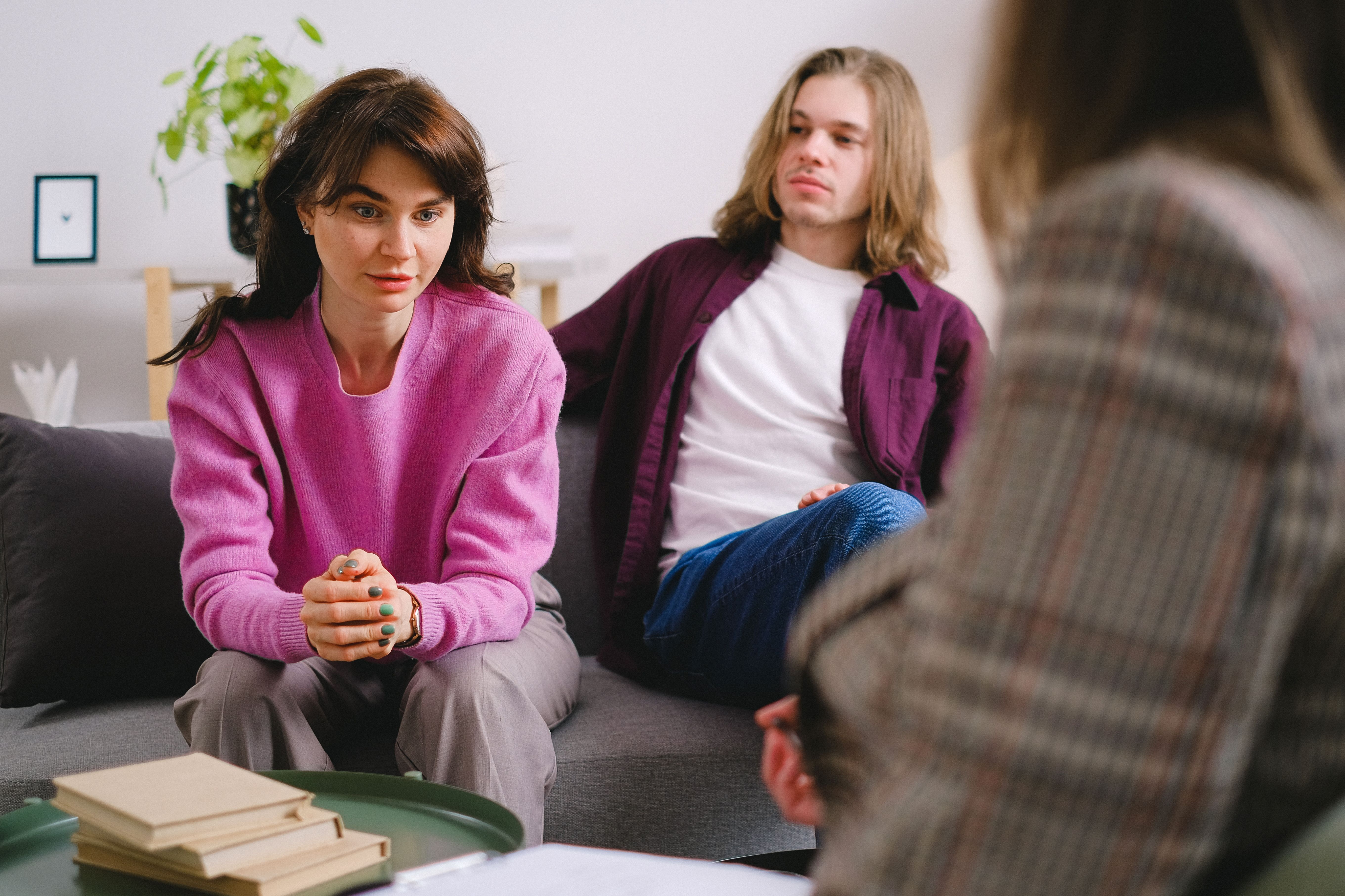 A couple engaging in a professional therapy session, seeking guidance.