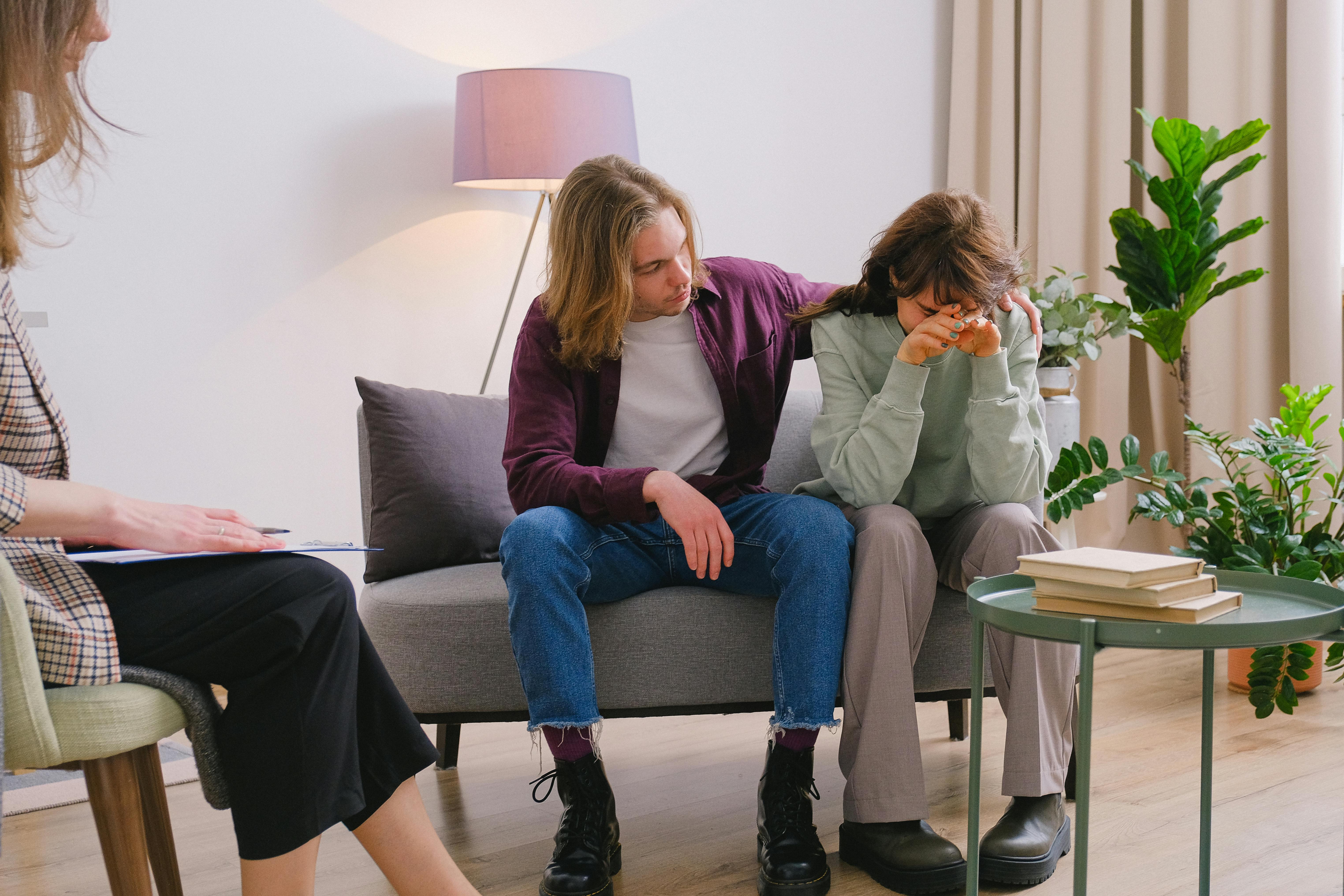 couple discussing problems during session with psychologist