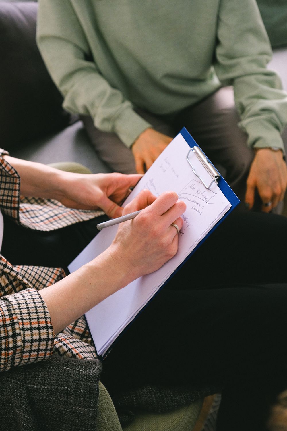 Clinician documenting a client's treatment progress