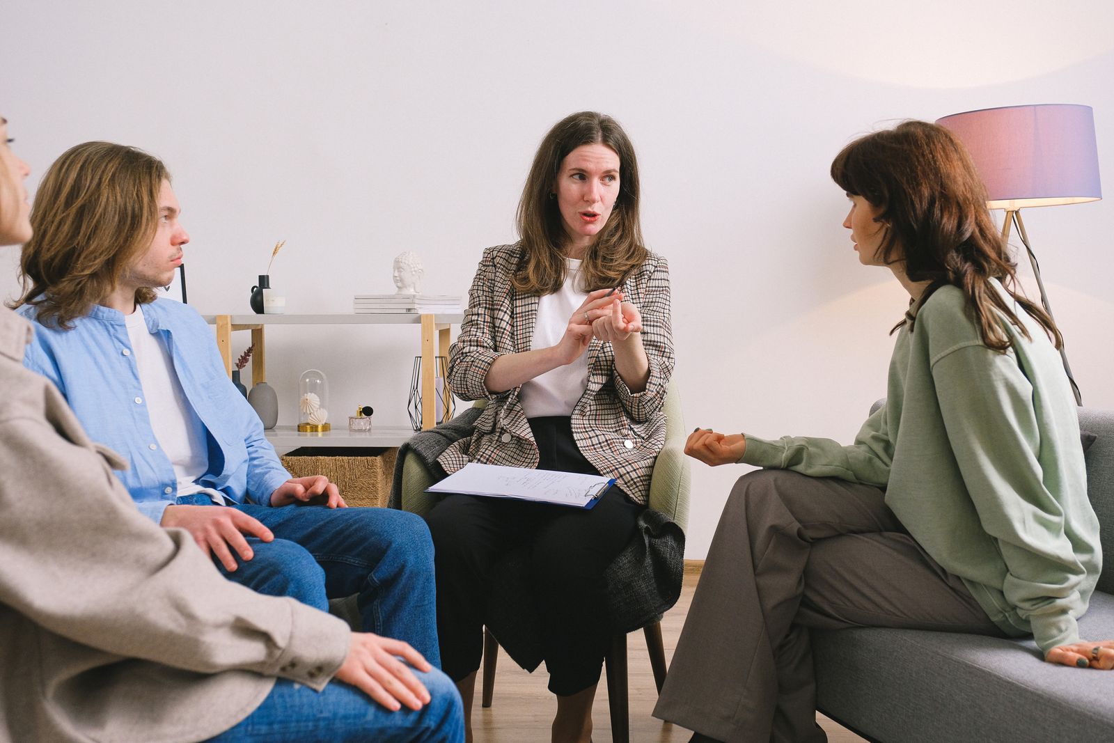 Therapist leading a structured outpatient group counseling session