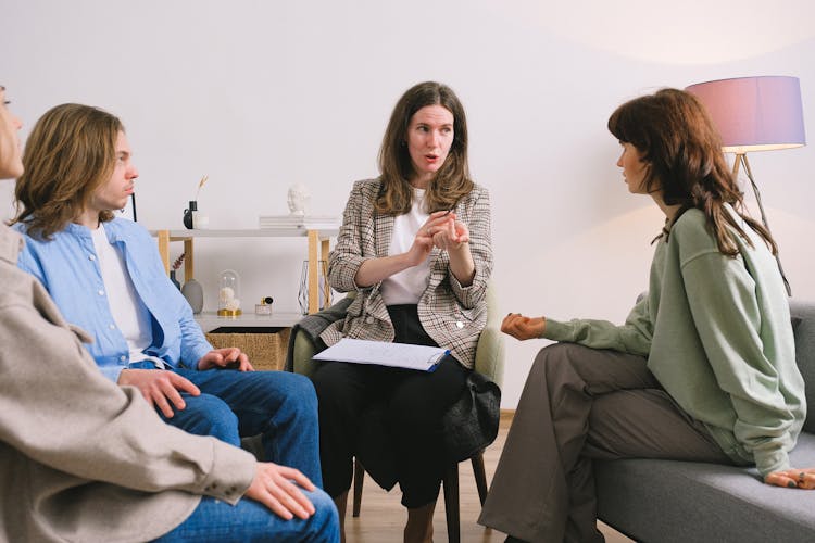 Psychotherapist Telling Advice To Group Of Patients