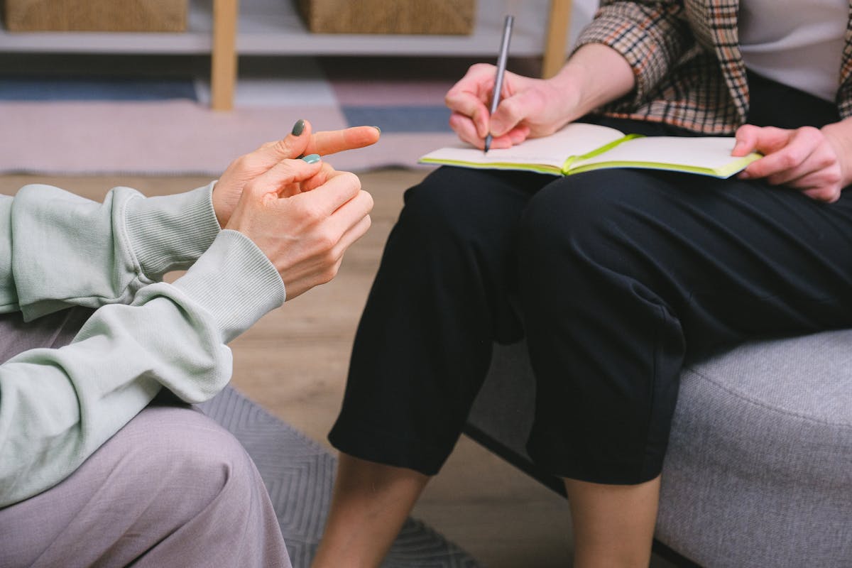 Women sharing experiences in group therapy setting