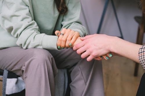 Free Crop psychologist supporting patient during counseling indoors Stock Photo