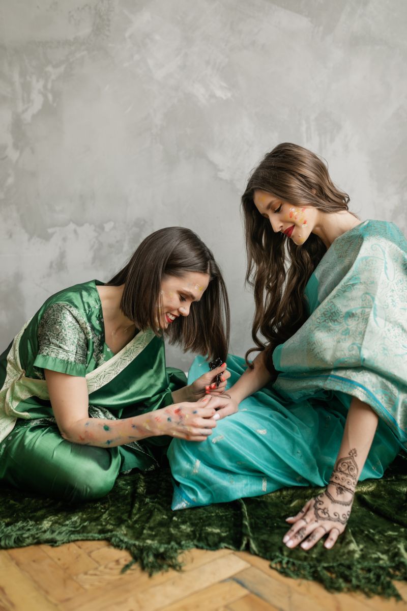 Friend applying mehndi at a henna party