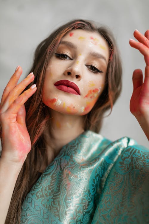 Close-Up Shot of a Woman With Face Paint on Her Face