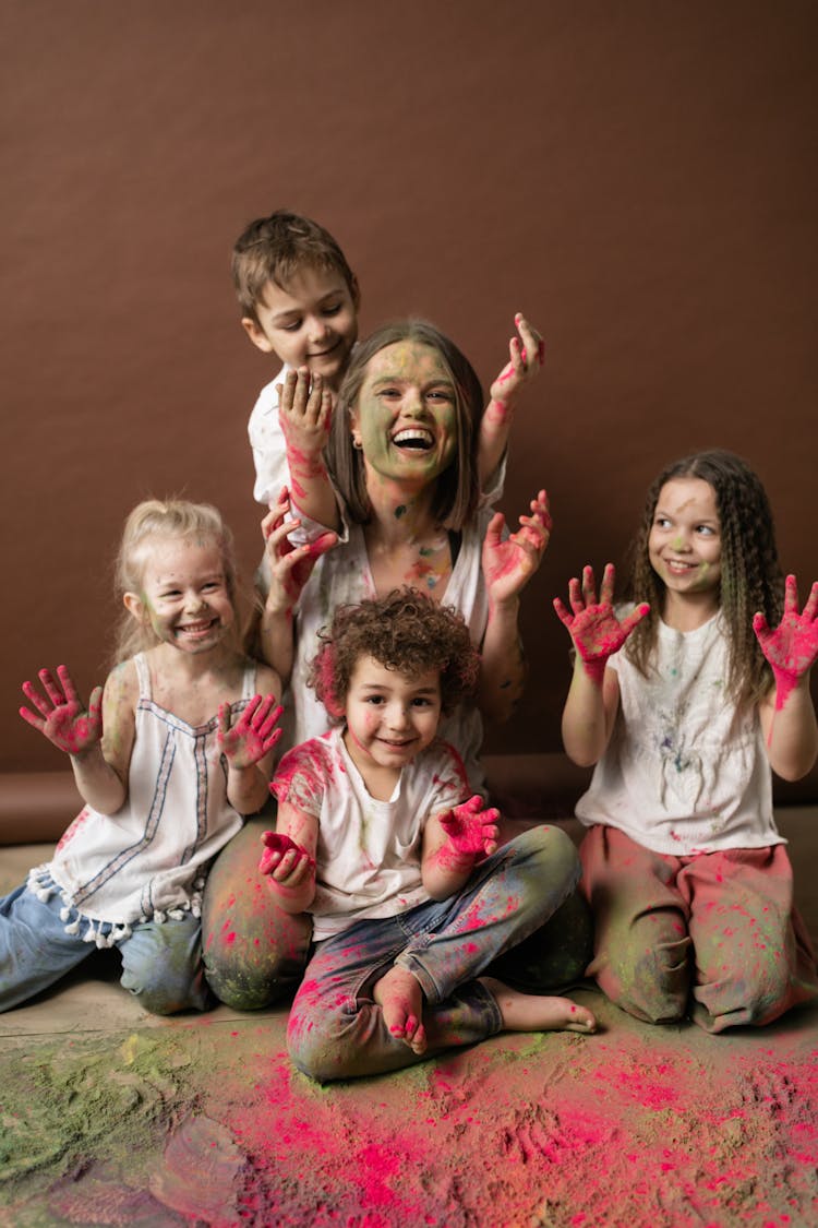 Photo Of A Woman And Kids With Holi Powder