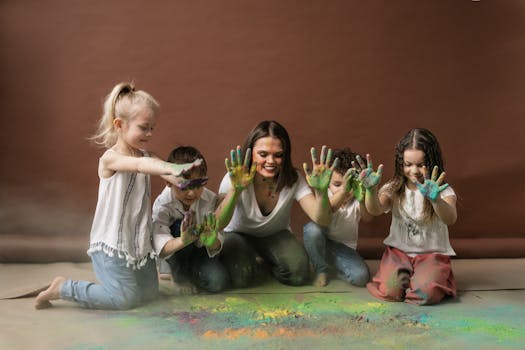 Children and adult enjoy Holi festival indoors, covered in vibrant powders. Captures friendship and fun.