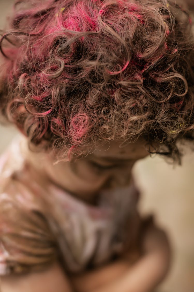 Little Boy With Colored Powder On Hair