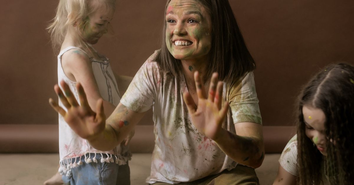 Powder Paint Playing Woman and Girls Playing with Powder Paint · Free Stock Photo