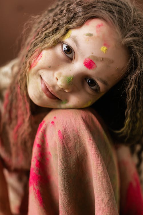 Girl with Red and Green Powder on her Face