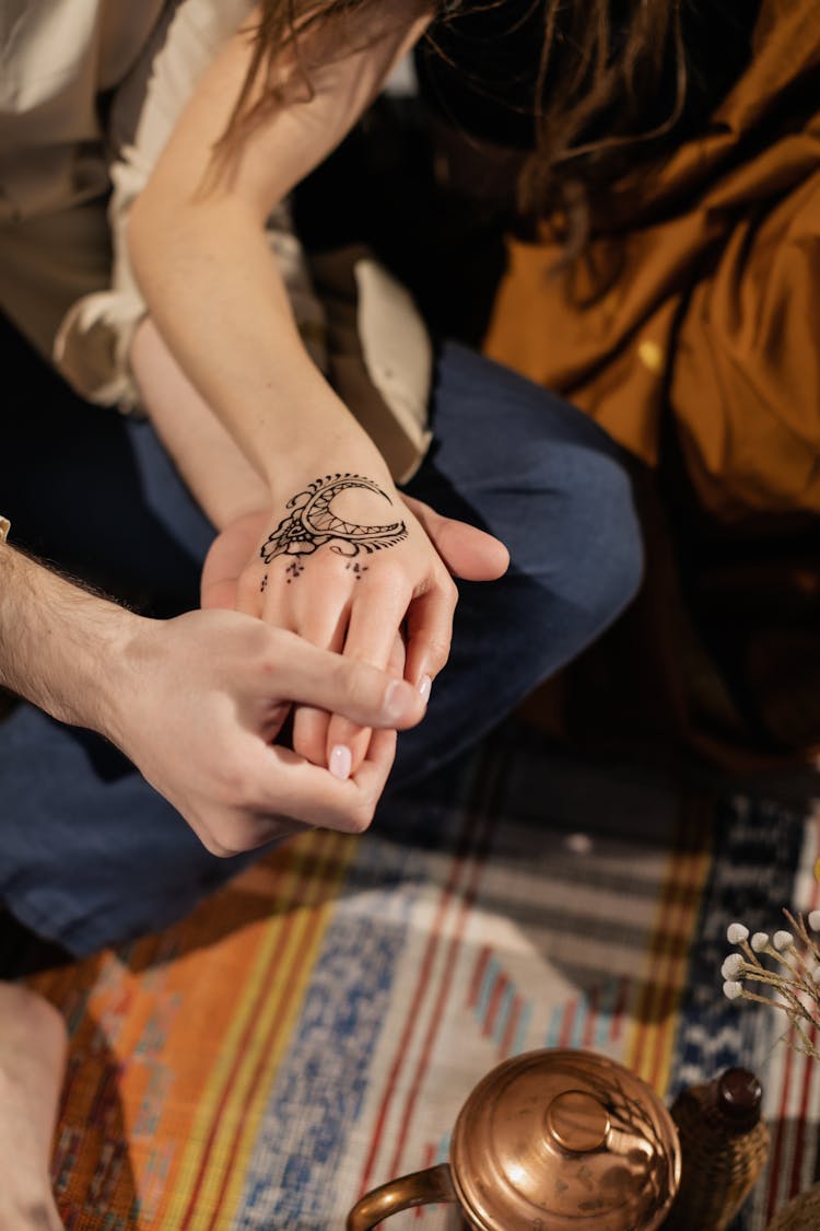 Hand With A Crescent Moon Tattoo