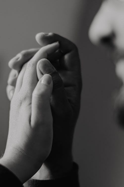 Free Monochrome Shot of Holding Hands Stock Photo
