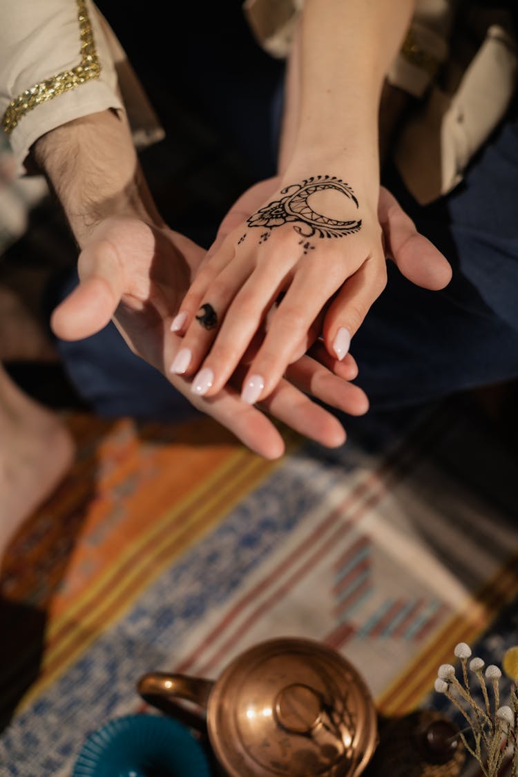 Hand With A Crescent Moon Tattoo