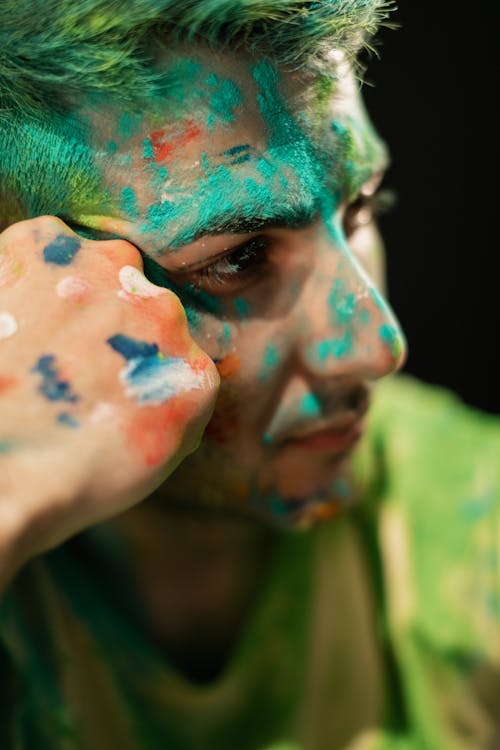 Close-Up Shot of a Man with Holi Powder on Face