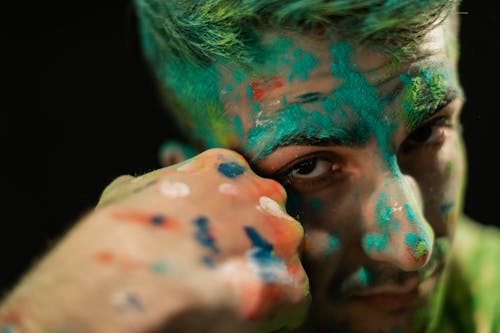 Close-Up Shot of a Man with Holi Powder on Face