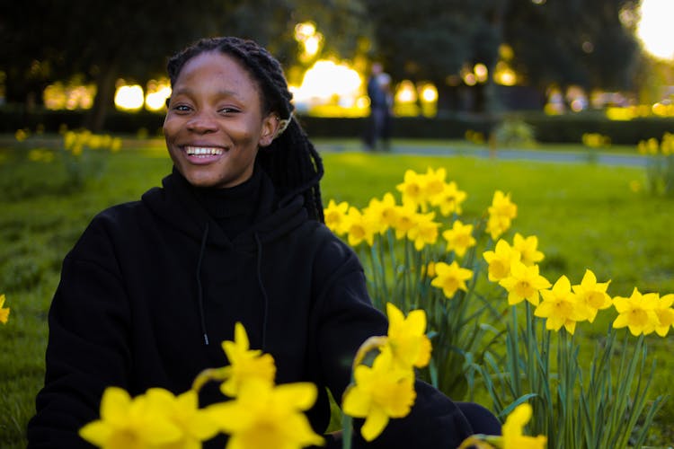 A Woman Surrounded By Daffodils 