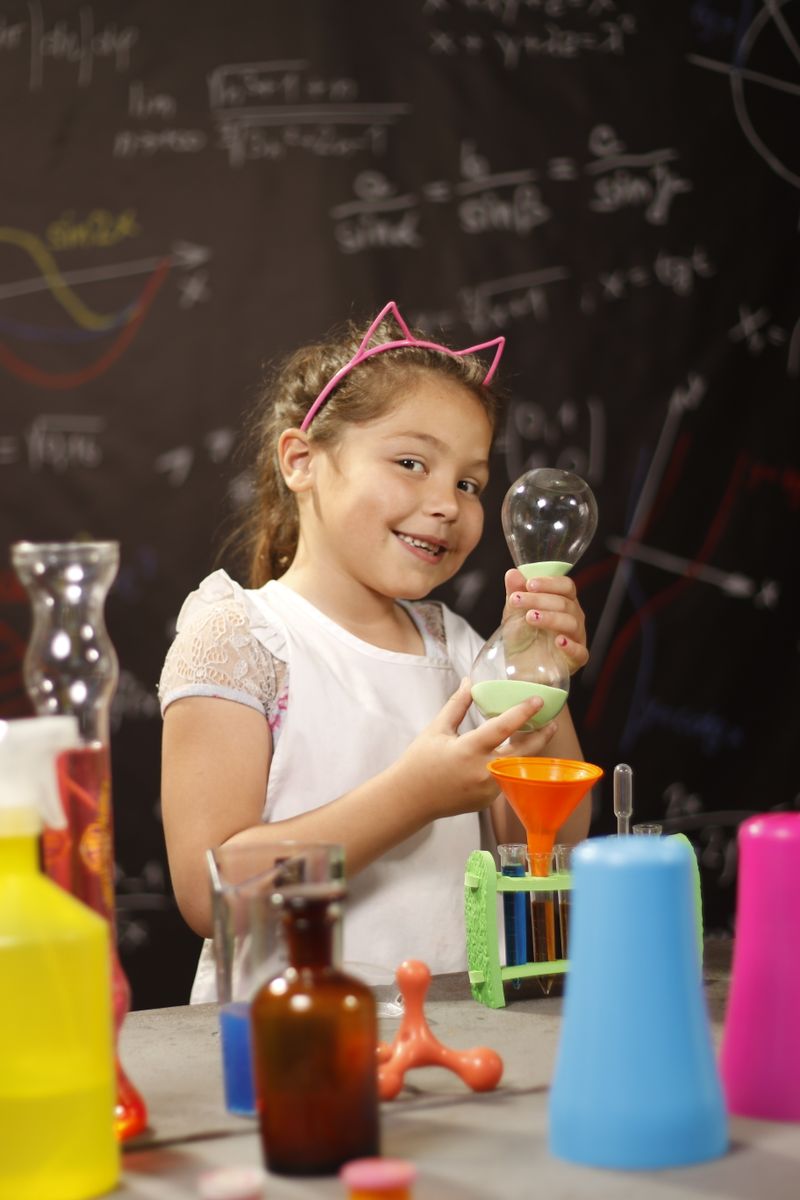Student holding materials from a science experiment
