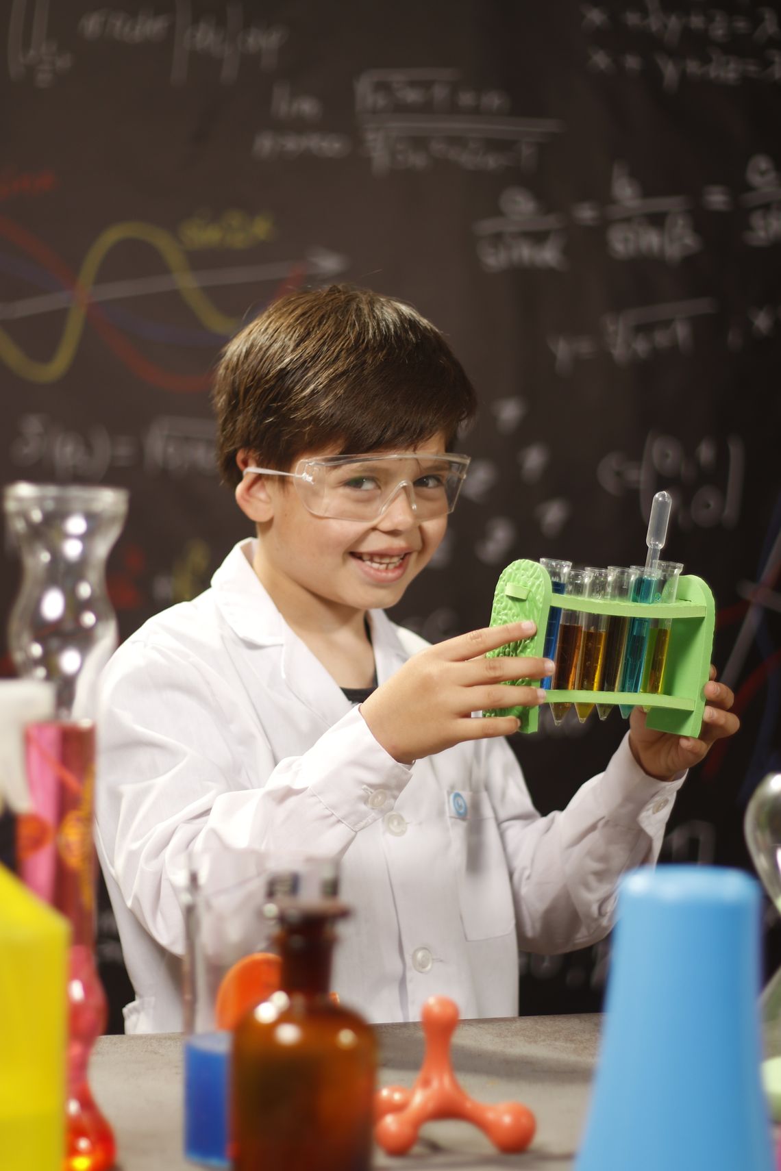 Young student proudly demonstrating a science project